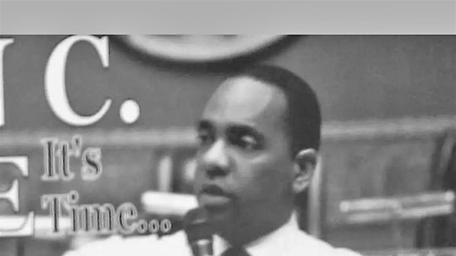 Black-and-white photo of Ronald C. Rice speaking into a microphone during his 2012 congressional campaign