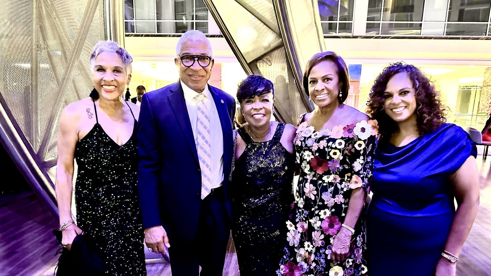 Libi Sprow Rice with colleagues at an evening gala
