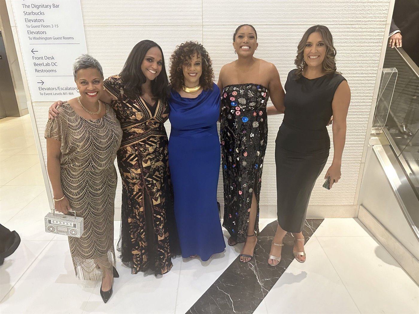Libi Sprow Rice with four colleagues in evening gowns at a gala